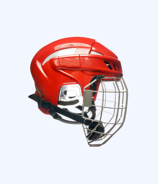 Red hockey helmet with cage